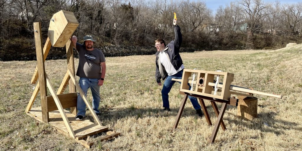 Image of trebuchet with Davis Sickmon on Left, Ballista with Atkeisson on Right